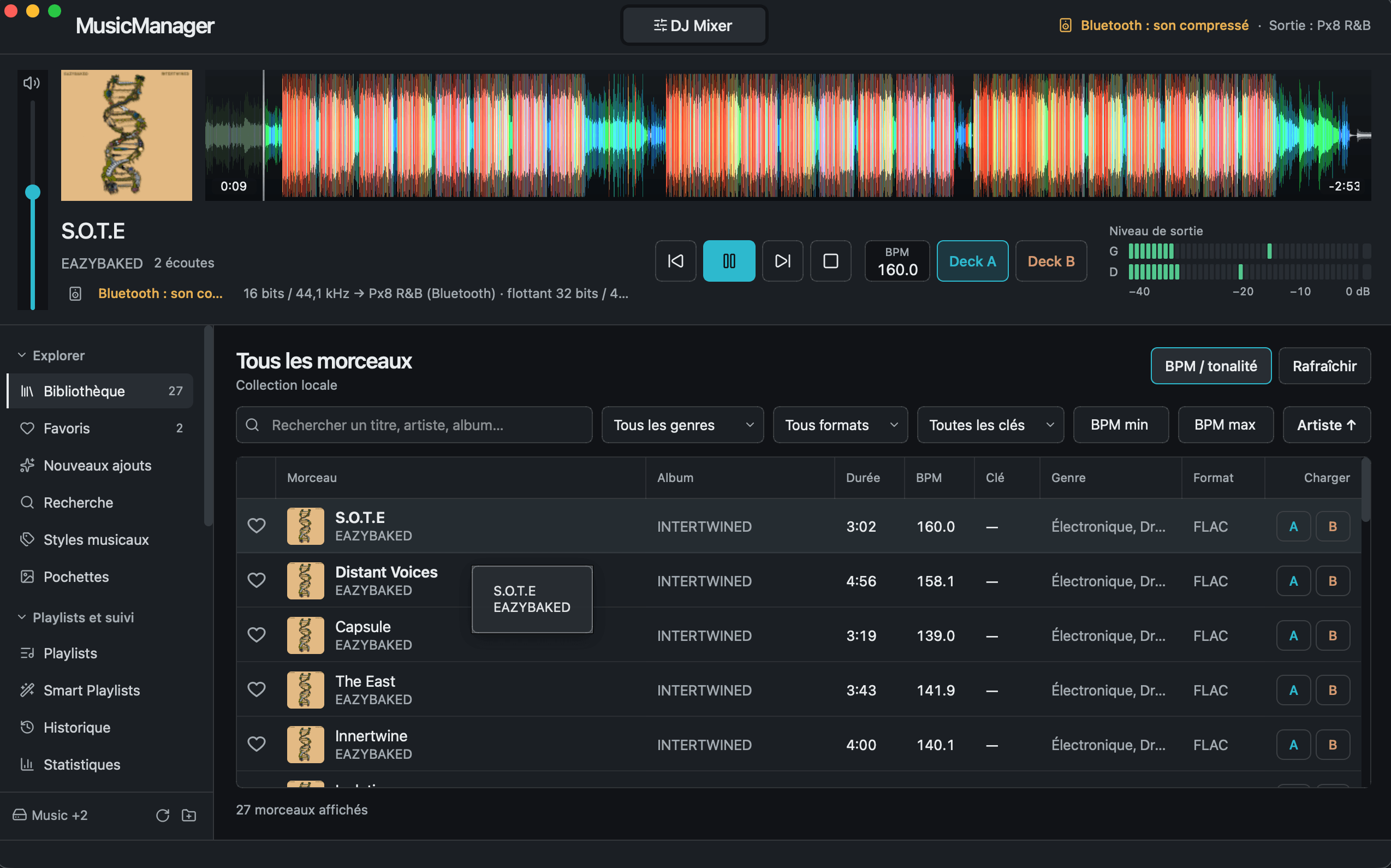MusicManager library view with the color waveform player and VU meter